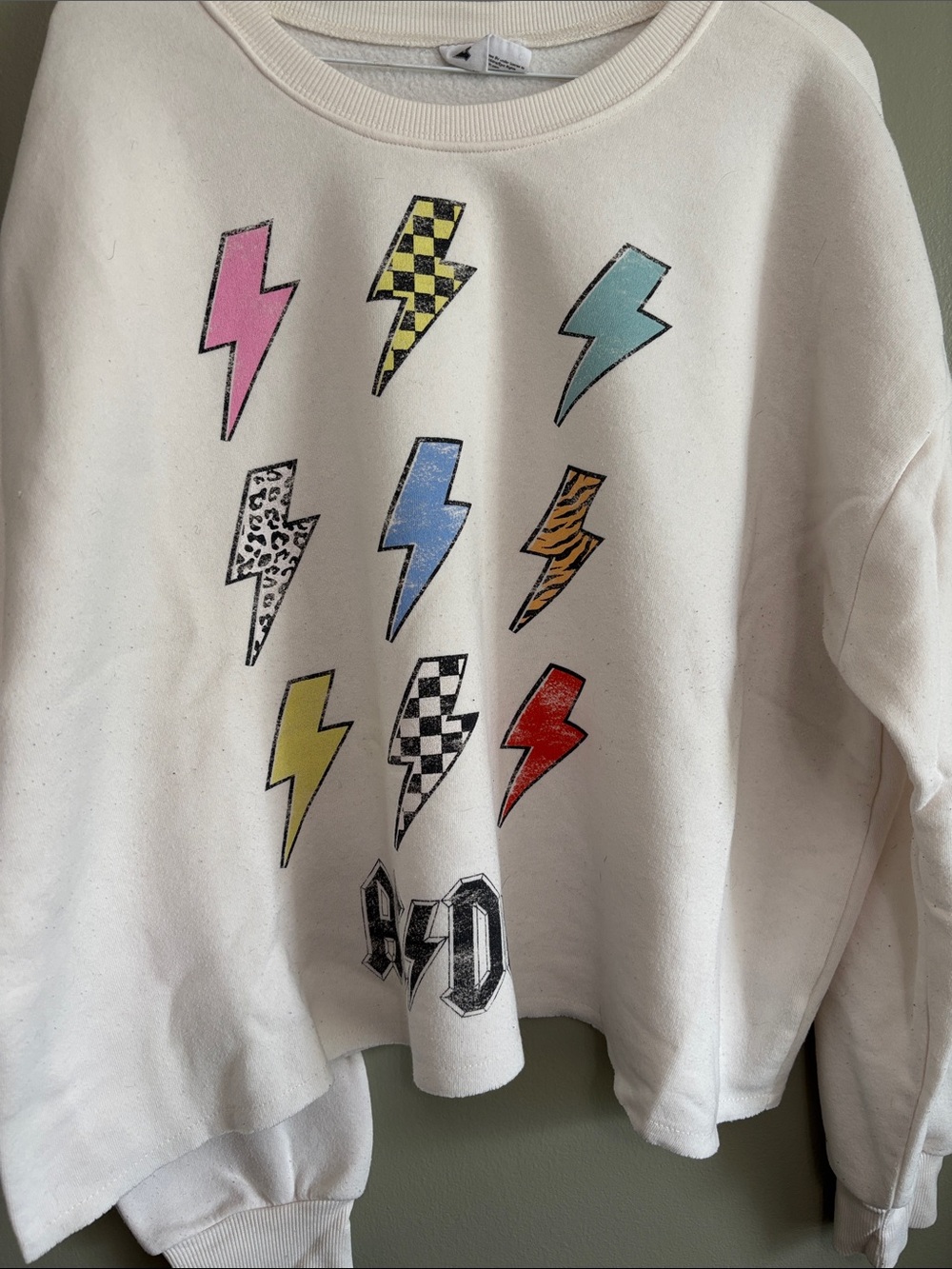 White Crewneck Sweatshirt with Colorful AC/DC Lightning Bolt Graphic